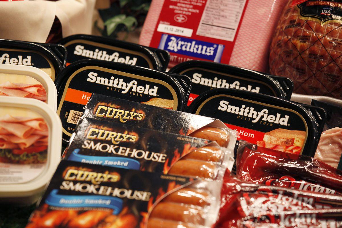 Some of the products of Smithfield Foods are displayed in front at a news conference on WH Group's IPO in Hong Kong on April 14, 2014. (Bobby Yip/Reuters)