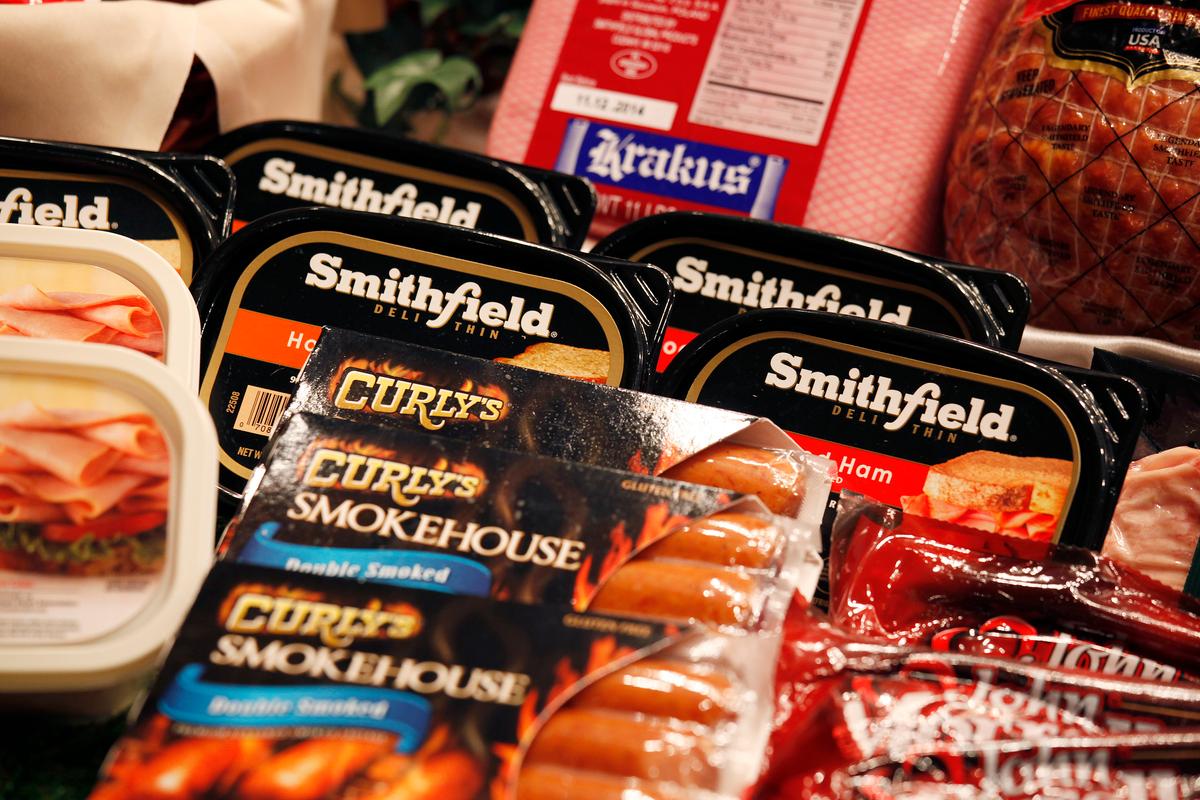 Some of the products of Smithfield Foods are displayed in front at a news conference on WH Group's IPO in Hong Kong on April 14, 2014. (Bobby Yip/Reuters)
