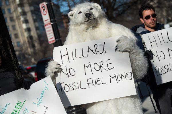 Environmental activists protest against the proposed Keystone XL pipeline in front of the Center for Strategic and International Studies (SCIS) where former U.S. Secretary of State Hillary Clinton is speaking on March 23, 2015. (NICHOLAS KAMM/AFP/Getty Images)