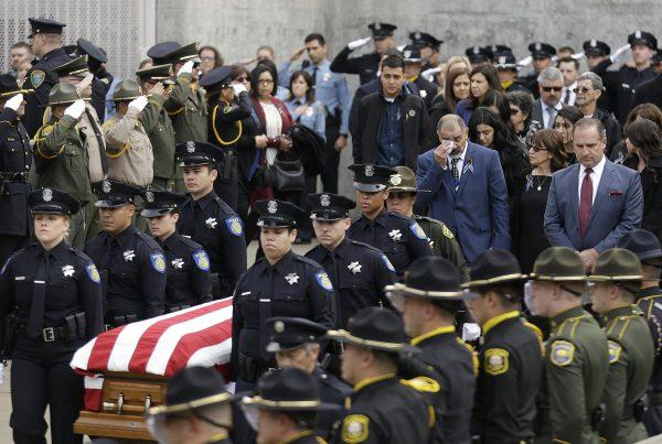 Family members follow the flag-draped coffin of Davis Police Officer Natalie Corona before funeral services for Corona at the University of California-Davis, in Davis, Calif., on Jan. 18, 2019. (Rich Pedroncelli/AP)