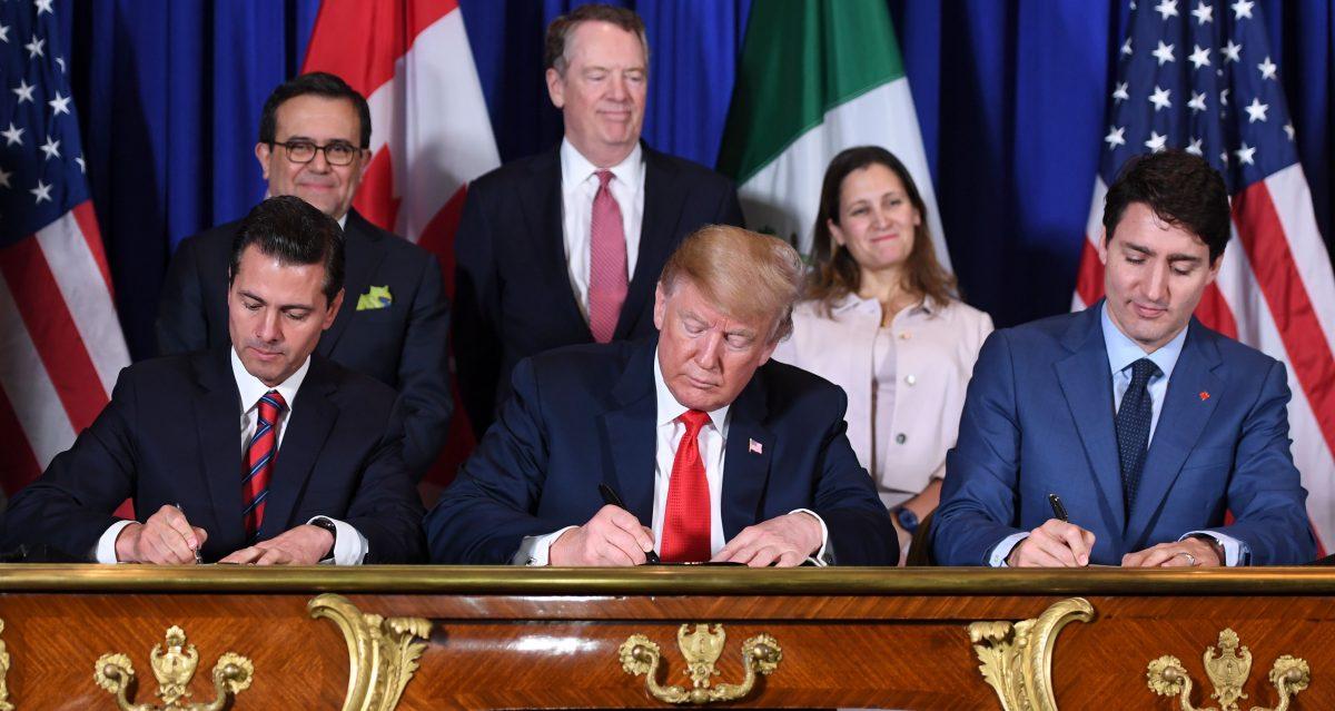 Mexican President Enrique Peña Nieto (L), President Donald Trump (C), and Canadian Prime Minister Justin Trudeau sign the USMCA agreement in Buenos Aires on Nov. 30, 2018. (Saul Loeb/AFP/Getty Images)
