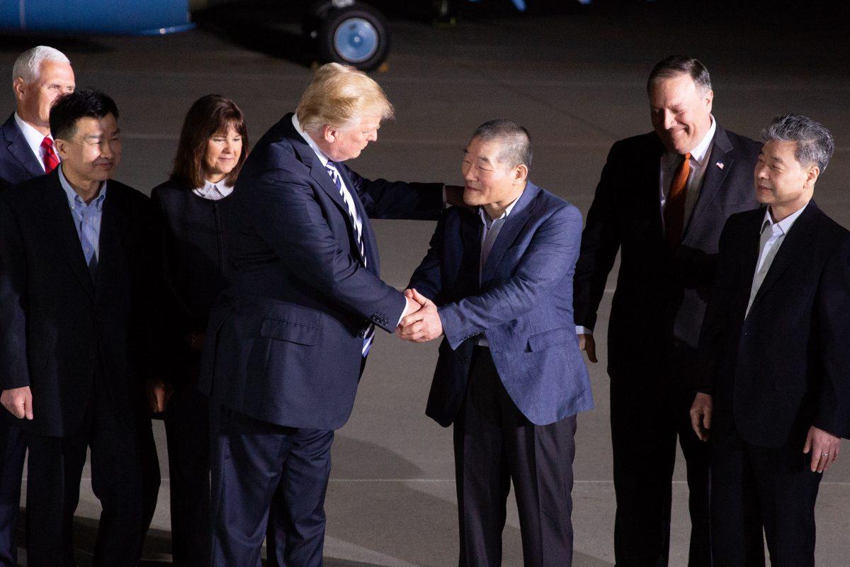 President Donald Trump greets Tony Kim, Kim Hak-song, and Kim Dong-chul, three Americans detained in North Korea for more than a year, as they arrive at Joint Base Andrews in Maryland on May 10, 2018. (Samira Bouaou/The Epoch Times)