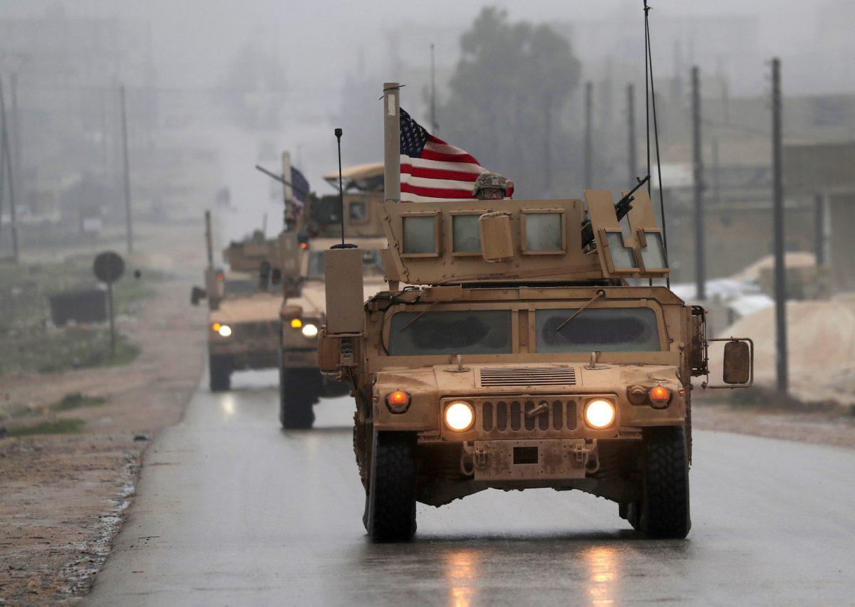 A line of U.S. military vehicles in Syria's northern city of Manbij on Dec. 30, 2018. (DELIL SOULEIMAN/AFP/Getty Images)