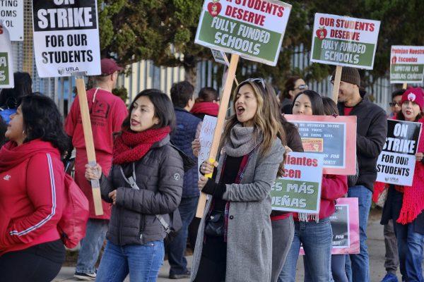 Striking Los Angeles Unified District teachers are joined by parents and students in front of Evelyn Thurman Gratts Elementary School in Los Angeles, Calif., on Jan. 22, 2019. (Richard Vogel/AP)