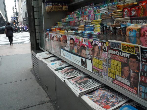 A copy of the National Enquirer (R) is seen at a newspaper vendor's shop on Third Avenue in midtown New York City, on Feb. 8, 2019. (Timothy A. Clary/AFP/Getty Images)