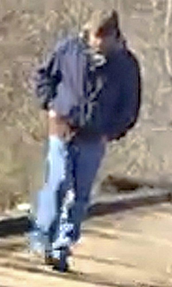 A man walking along the trail system in Delphi, Ind., that authorities say is a suspect in the killings of two teenage girls. (Indiana State Police via AP, File)