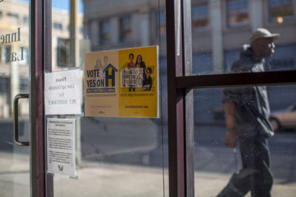 Signage supporting Measure H, a quarter-cent county sales tax increase to fund the fight against homelessness, is seen at the Inner City Law Center in Los Angeles, Calif., on March 7, 2017. (Photo by David McNew/Getty Images)
