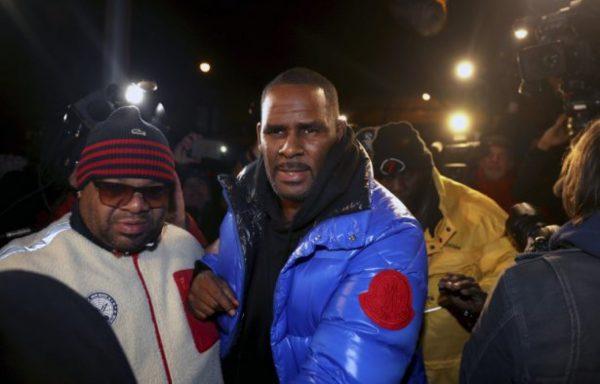 R. Kelly turns himself in at 1st District police headquarters in Chicago on Feb. 22, 2019. (Chris Sweda/Chicago Tribune via AP)