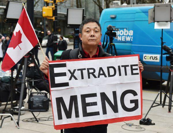 Max Wang protests Huawei Chief Financial Officer Meng Wanzhou's court appearance at British Columbia Supreme Court, in Vancouver, on March 6, 2019. - Meng, the Chinese telecom executive at the center of an escalating row between Ottawa and Beijing, was due in court in Canada to get a date for a hearing into a U.S. extradition request. Meng's arrest in Vancouver in December 2018 on a U.S. warrant infuriated Beijing, which arrested several Canadians days later in what was widely seen as retaliation or "hostage diplomacy." (Don MacKinnon/AFP/Getty Images)