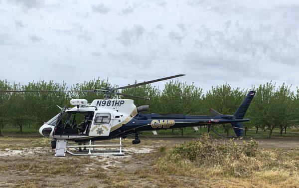 A California Highway Patrol helicopter near where two teenage boys were electrocuted while trying to rescue a dog from an irrigation canal at an orchard in Dixon, California, on April 1, 2019. (California Highway Patrol/Via AP)