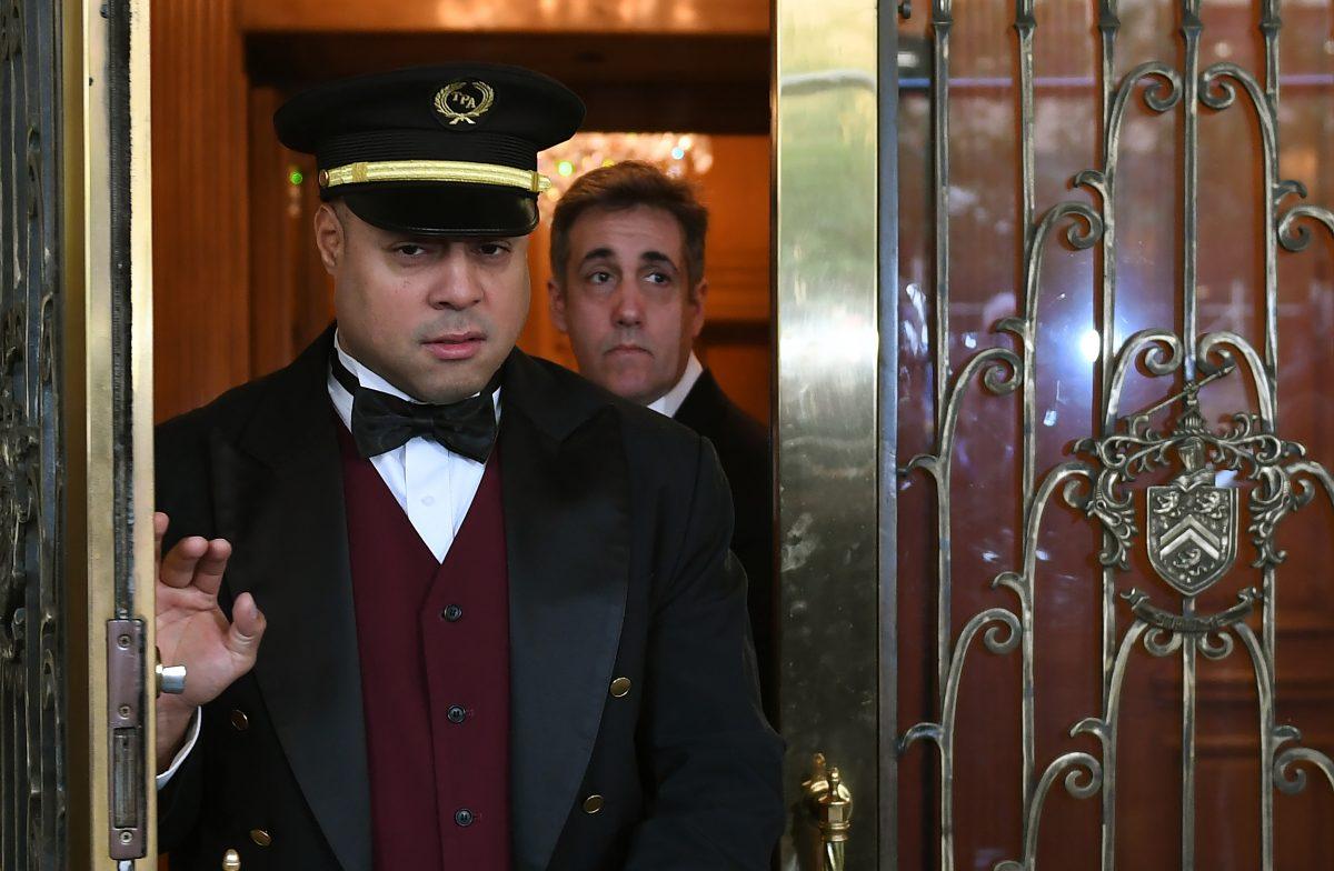 Michael Cohen (R) leaves his Park Avenue apartment in New York City to begin serving a three-year sentence at a federal prison in Otisville, N.Y., on May 6, 2019. (Timothy A. Clary/AFP/Getty Images)