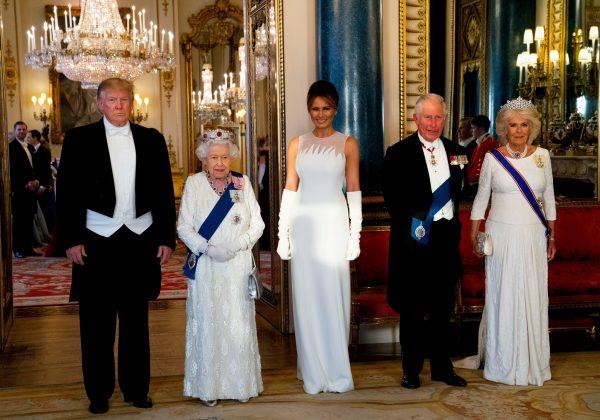 Queen Elizabeth II (2L), U.S. President Donald Trump (L), U.S. First Lady Melania Trump (C), Britain's Prince Charles, Prince of Wales (2R), and Britain's Camilla, Duchess of Cornwall pose for a photograph in the ballroom at Buckingham Palace in central London on June 3, 2019. (Doug Mills/AFP/Getty Images)