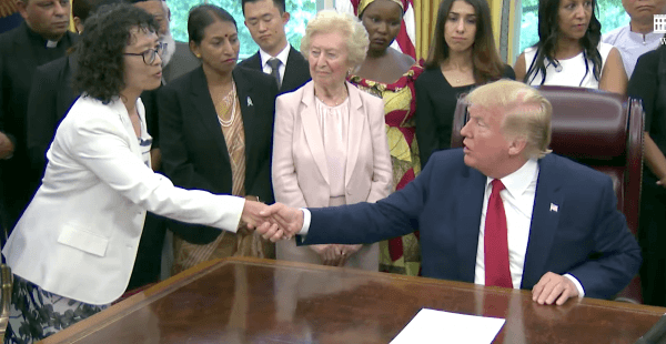 President Donald Trump shakes hands with Zhang Yuhua, a Falun Gong practitioner who survived persecution in China, at the White House in Washington, on July 17, 2019. (Screenshot/The White House)