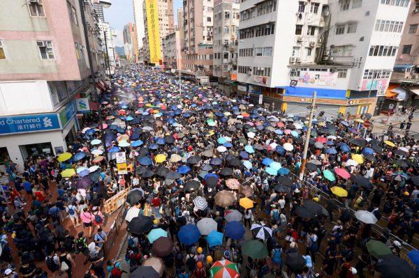 Protesters join a march in Yuen Long, Hong Kong, on July 27, 2019. (Song Bilong/The Epoch Times)