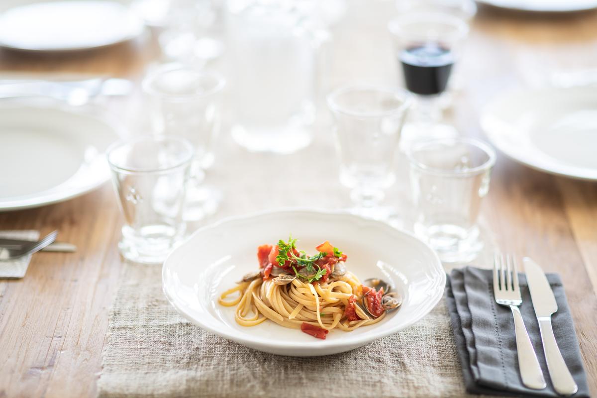 Dishes in Le Marche are based on local produce, with most ingredients gathered from the the land and sea. Fresh egg pasta, clams, and fresh vegetables are a simple but satisfying lunch. (Courtesy of Villa Olivo)