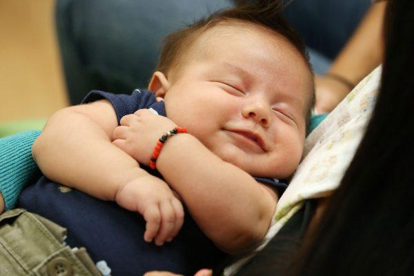 A baby is held in this file photo taken in Los Angeles on Sept. 19, 2012. (Alexandra Wyman/Getty Images)