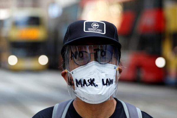 An anti-government protester wearing a mask attends a lunch time protest, after local media reported on an expected ban on face masks under emergency law, at Central, in Hong Kong on Oct. 4, 2019. (Tyrone Siu/Reuters)