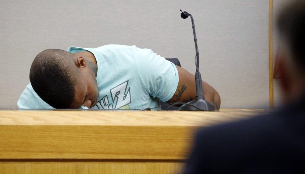 In this Tuesday, Sept. 24, 2019, file photo, Joshua Brown, a neighbor of victim Botham Jean, is overcome with emotion while giving testimony in court, in Dallas, after recounting how he'd heard Jean singing gospel and Drake songs across the hall before he was fatally shot. Authorities say that Brown was killed in a shooting Friday, Oct. 4. (Tom Fox/The Dallas Morning News via AP, Pool, File)