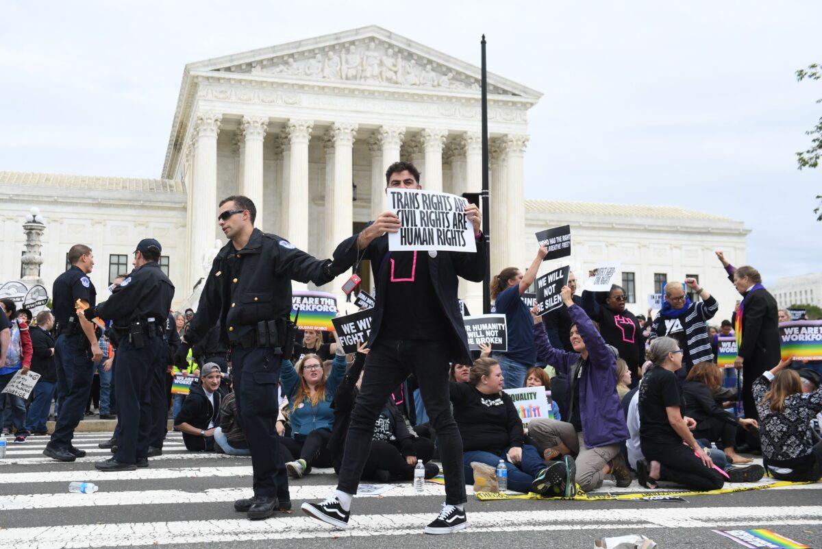 Pro-LGBT demonstrators rally outside the Supreme Court in Washington on Oct. 8, 2019. (Saul Loeb/AFP via Getty Images)