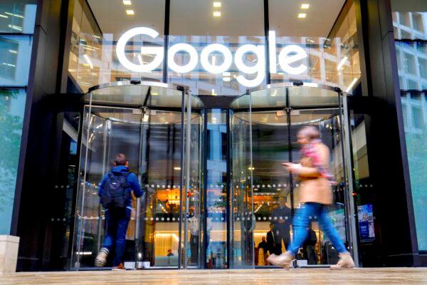 People walk past Google's UK headquarters in London on Nov. 1, 2018.  (Tolga Akmen/AFP/Getty Images)