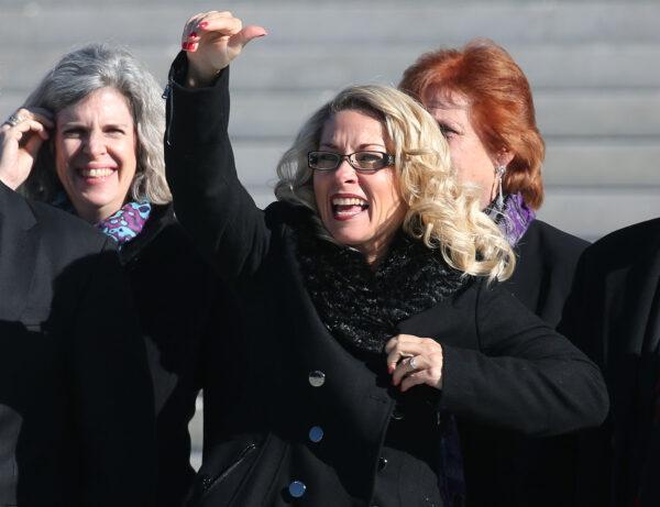 Rebecca Friedrichs waves to supporters after arguments at the U.S. Supreme Court in Washington on Jan. 11, 2016. (Mark Wilson/Getty Images)