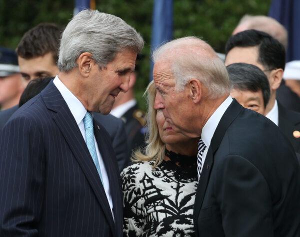 Then-Vice President Joe Biden (R) speaks with then-Secretary of State John Kerry in Washington in a 2015 file photograph. (Mark Wilson/Getty Images)
