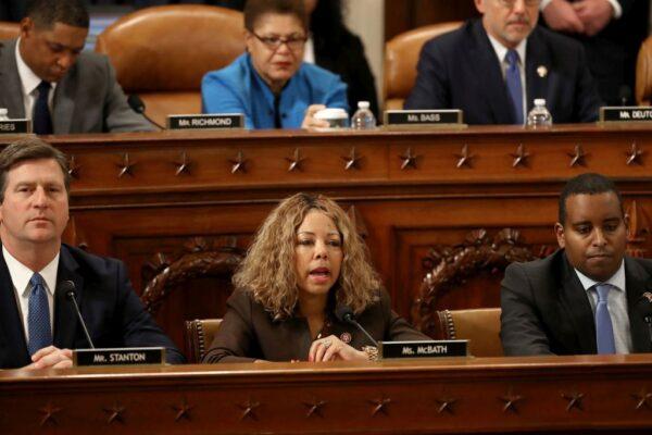 House Judiciary Committee member Rep. Lucy McBath (D-Ga.) (C) votes for the first of two articles of impeachment against U.S. President Donald Trump during the final moments of a hearing in the Longworth House Office Building on Capitol Hill in Washington on Dec. 13, 2019. (Chip Somodevilla/Getty Images)