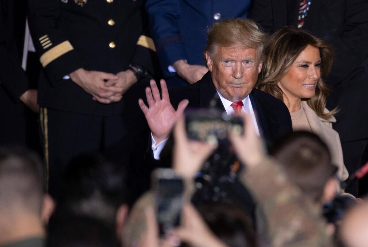 President Donald Trump and First Lady Melania Trump greet troops at the signing ceremony for S.1709, The National Defense Authorization Act for Fiscal Year 2020 in Joint Base Andrews, Maryland on Dec. 20, 2019. (Tasos Katopodis/Getty Images)