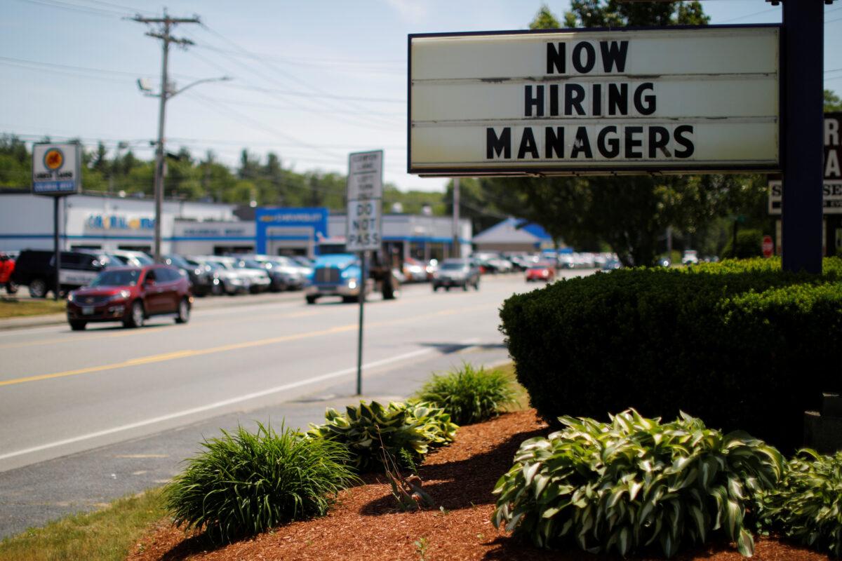 The sign on a Taco Bell restaurant advertises "Now Hiring Managers" in Fitchburg, Massachusetts, on June 12, 2018. (Reuters/Brian Snyder)