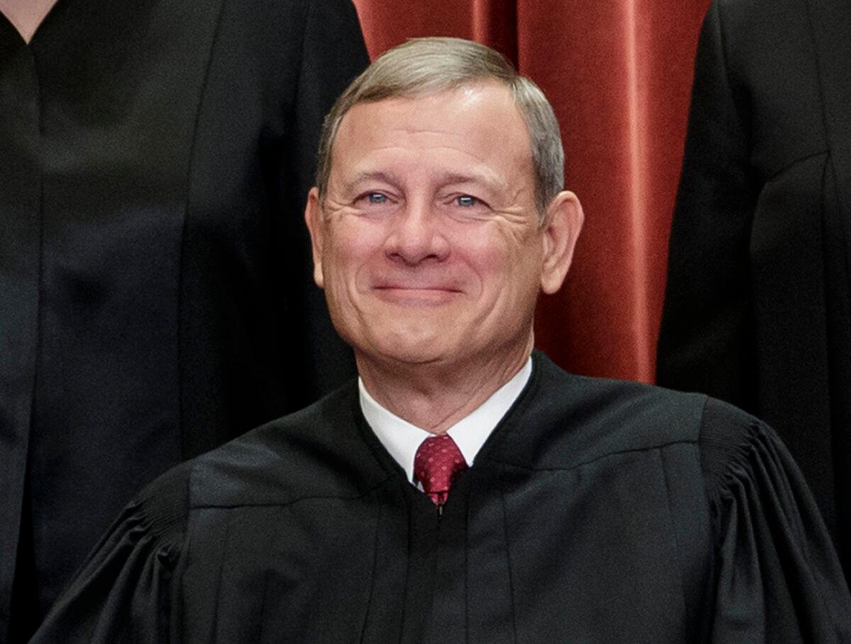 This Nov. 30, 2018, file photo shows Chief Justice of the United States, John Roberts, as he sits with fellow Supreme Court justices for a group portrait at the Supreme Court Building in Washington. (J. Scott Applewhite/AP Photo)