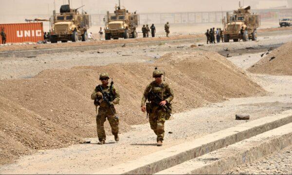 U.S. soldiers walk at the site of a Taliban suicide attack in Kandahar in a file photo. (Javed Tanveer/AFP/Getty Images)