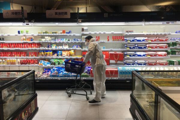A customer pushes a cart while shopping inside a supermarket of Alibaba's Hema Fresh chain, following an outbreak of the novel coronavirus in Wuhan, Hubei Province, China, on Feb. 11, 2020. (Stringer/Reuters)
