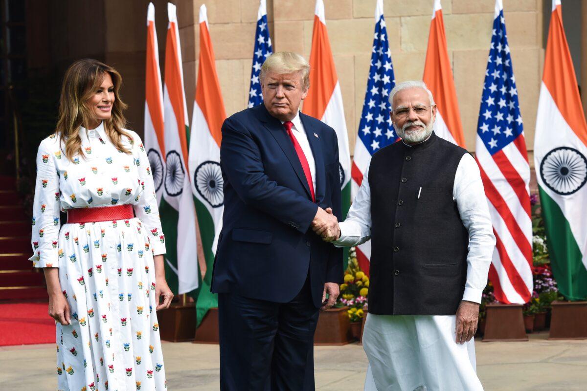 India's Prime Minister Narendra Modi (R) shakes hands with U.S. President Donald Trump as First Lady Melania Trump looks on before a meeting at Hyderabad House in New Delhi, India, on Feb. 25, 2020. (Prakash SinghH/AFP via Getty Images)