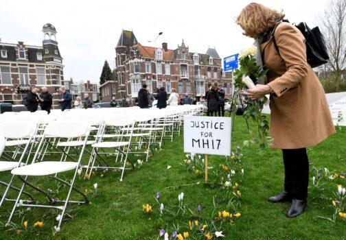 Family members of victims of the MH17 crash protest outside the Russian Embassy, lining up empty chairs for each seat on the plane, in The Hague, Netherlands, on March 8, 2020. (Piroschka van de Wouw/Reuters)