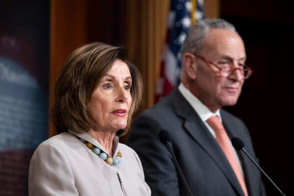 House Speaker Nancy Pelosi (D-Calif.), joined by Senate Minority Leader Chuck Schumer (D-N.Y.), speaks during a news conference on Capitol Hill in Washington on Feb. 11, 2020. (Alex Brandon/AP Photo)