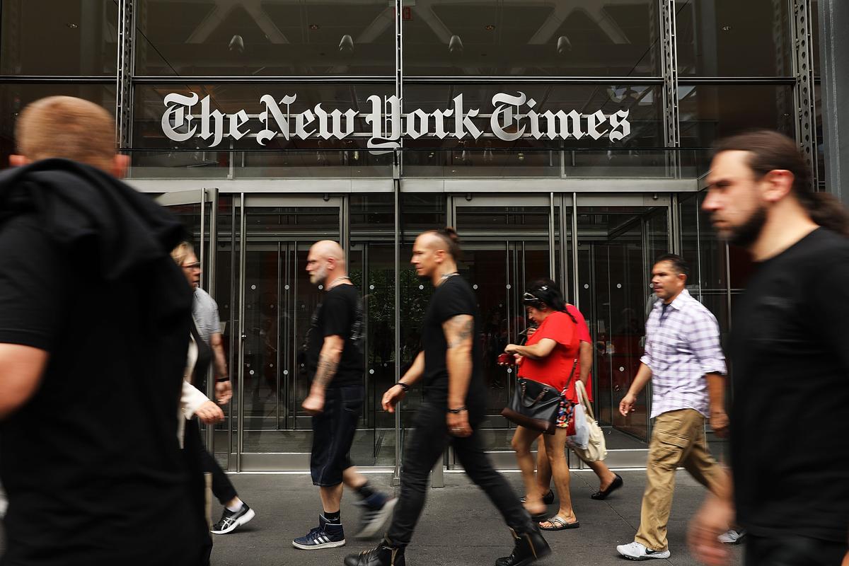 People walk past the New York Times building in New York City on July 27, 2017. (Spencer Platt/Getty Images)