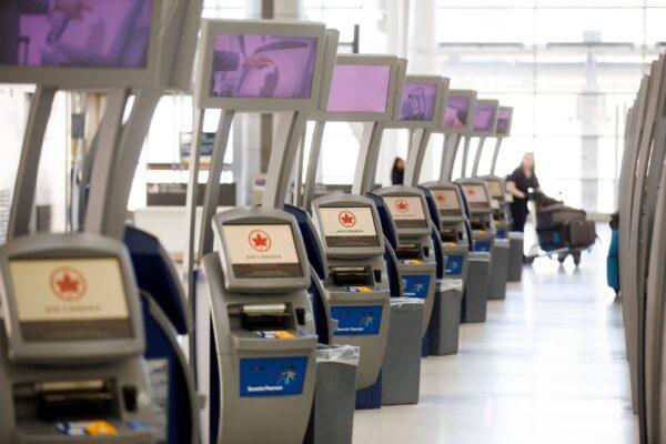 Unused Air Canada check-in kiosks are seen at Toronto Pearson International Airport in Toronto, Canada, on April 1, 2020. (Cole Burston/Getty Images)