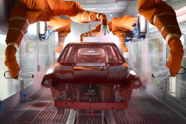 Robotic arms paint a car at the BYD Automobile Company Limited Xi’an plant, in Shaanxi Province, China, on Dec. 25, 2019. (China Daily via Reuters)