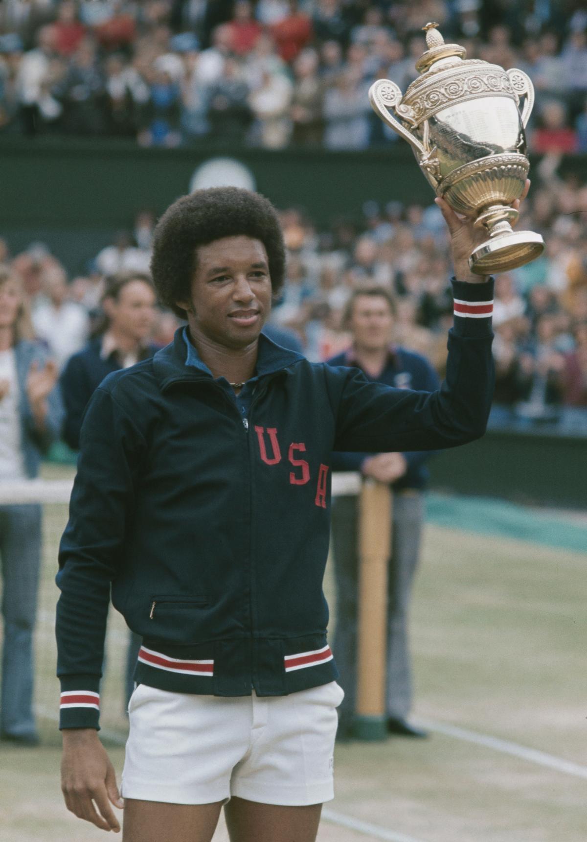 American tennis player Arthur Ashe (1943–1993) wins the Men's Singles at Wimbledon, London, 5th July 1975. (Central Press/Hulton Archive/Getty Images)