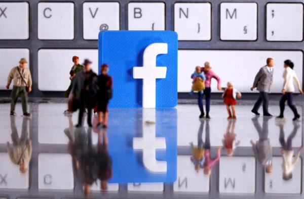 File photo of a 3D printed Facebook logo and toy people figures in front of a keyboard in this illustration taken April 12, 2020. (Dado Ruvic/Illustration/Reuters)
