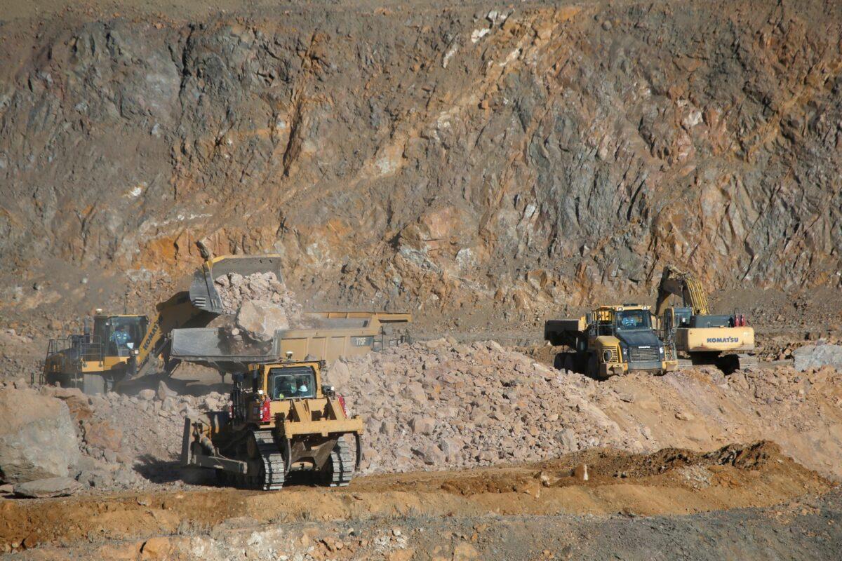 Wheel loaders fill trucks with ore at the MP Materials rare earth mine in Mountain Pass, Calif., on Jan. 30, 2020. (Steve Marcus/Reuters)