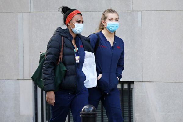 Medical workers arrive for their shift at New York-Presbyterian Hospital/Weill Cornell Medical Center during the COVID-19 pandemic in New York City on April 21, 2020. Cindy Ord/Getty Images)
