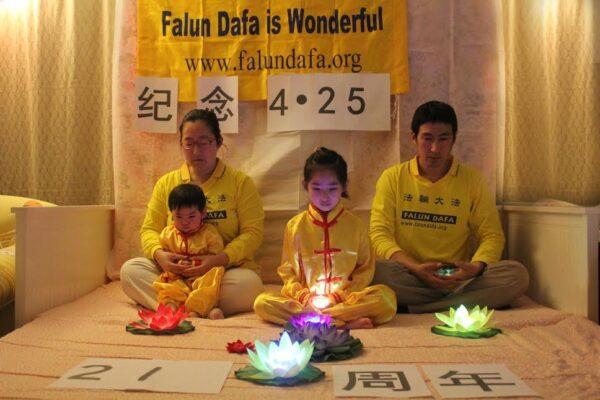 A family participates in the online candle vigil to commemorate the persecution of Falun Gong practitioners in China, on April 23, 2020. (Courtesy of Tuidang Center)