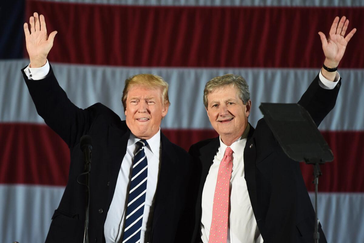 Then President-elect Donald Trump (L) and then Louisiana Treasurer and Republican Senate candidate John Kennedy wave at a rally in Baton Rouge, Louisiana, on Dec. 9, 2016. (Don Emmert/AFP/Getty Images)