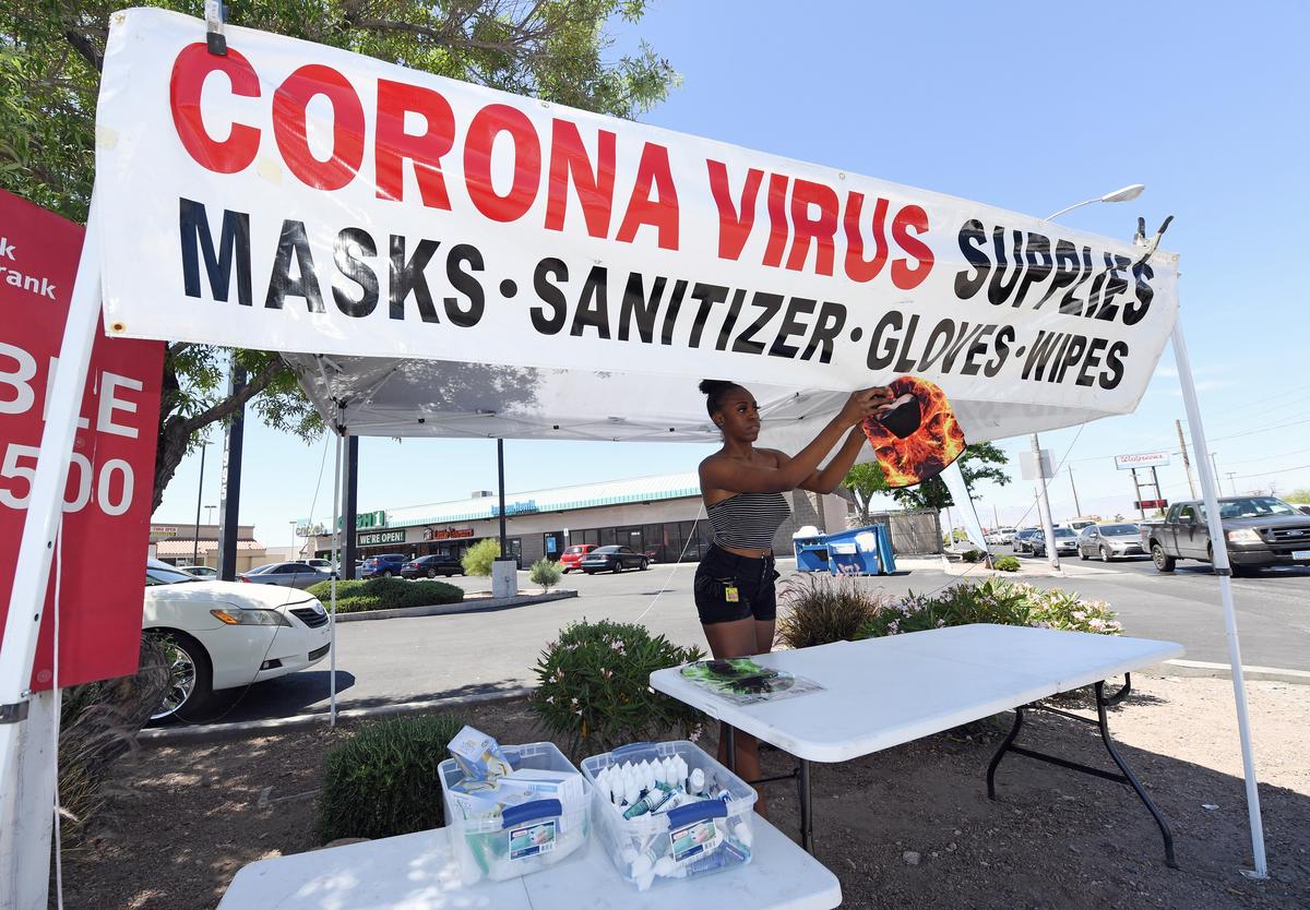 Janeisha Lee of Nevada sets up a pop-up CCP virus supply tent in Las Vegas, Nevada, on April 29, 2020. (Ethan Miller/Getty Images)