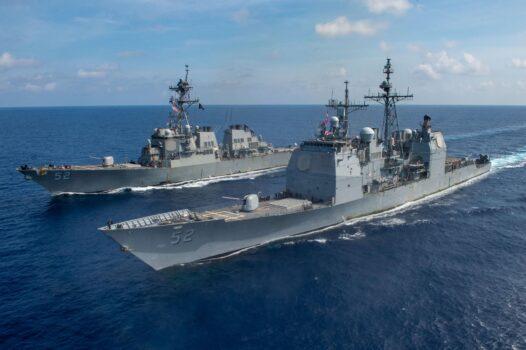 The guided missile cruiser USS Bunker Hill (CG 52) (F) and the Arleigh Burke-class guided-missile destroyer USS Barry (DDG 52) transit the South China Sea. (U.S. Navy photo by Mass Communication Specialist 3rd Class Nicholas V. Huynh/Released)