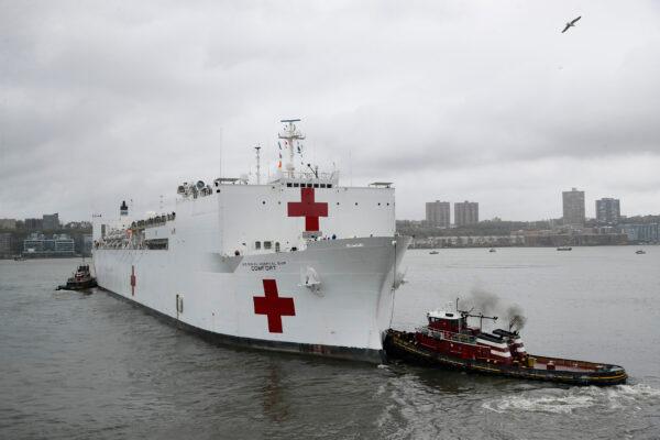 The USNS Naval Hospital Ship Comfort departs via the Hudson River, Thursday, April 30, 2020, in the Manhattan borough of New York. (John Minchillo/AP photo)