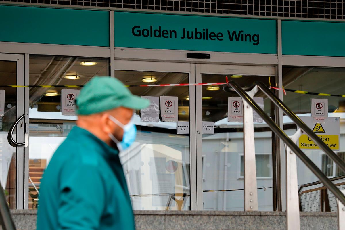 A paramedic wearing stands outside of the Golden Jubilee Wing of King's College Hospital in London, UK, on April 29, 2020. (Tolga Akmen/AFP via Getty Images)