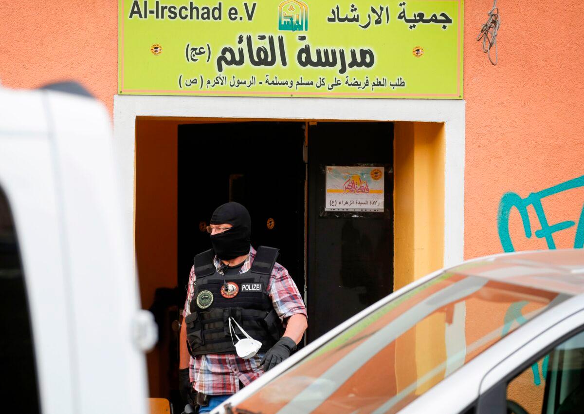 A police officer walks out of Al-Irschad Mosque during raids on mosques and associations linked to Hezbollah in Bremen, Berlin, in Germany on April 30, 2020. (Odd Andersen/AFP via Getty Images)