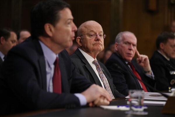 Then-FBI Director James Comey, Director of National Intelligence James Clapper, and CIA Director John Brennan (L-R) testify before the Senate (Select) Intelligence Committee in Washington on Jan. 10, 2017. (Joe Raedle/Getty Images)